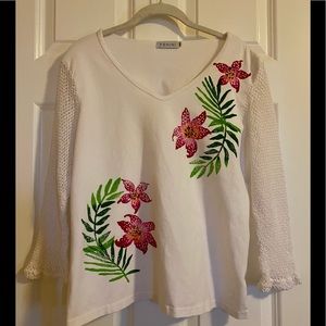 Fenini V-neck top with mesh sleeves.